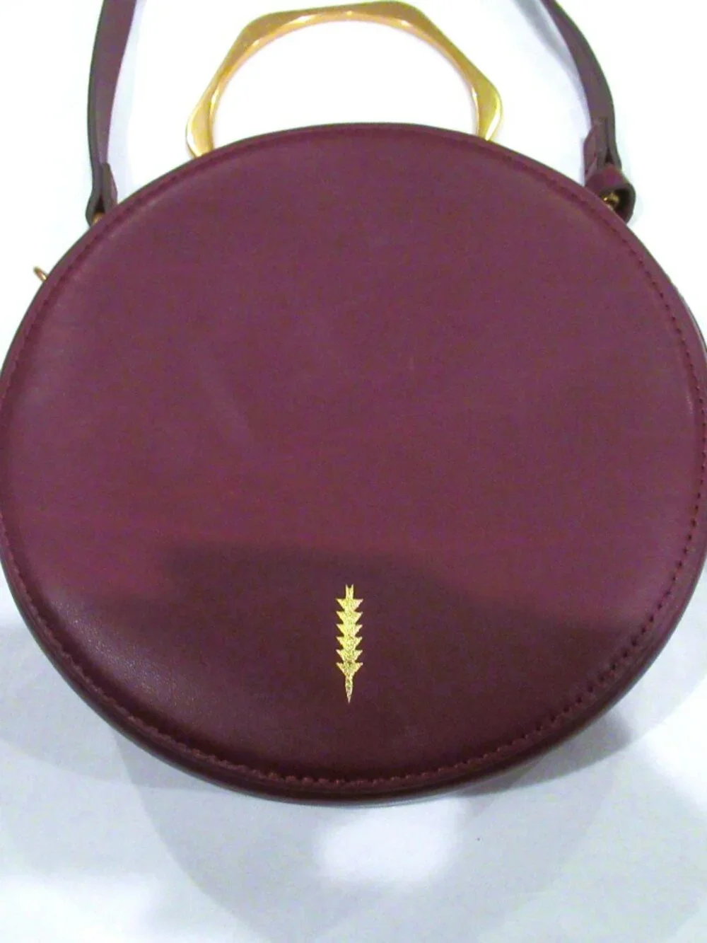 Thacker burgundy purse, both a crossbody and a bracelet handle